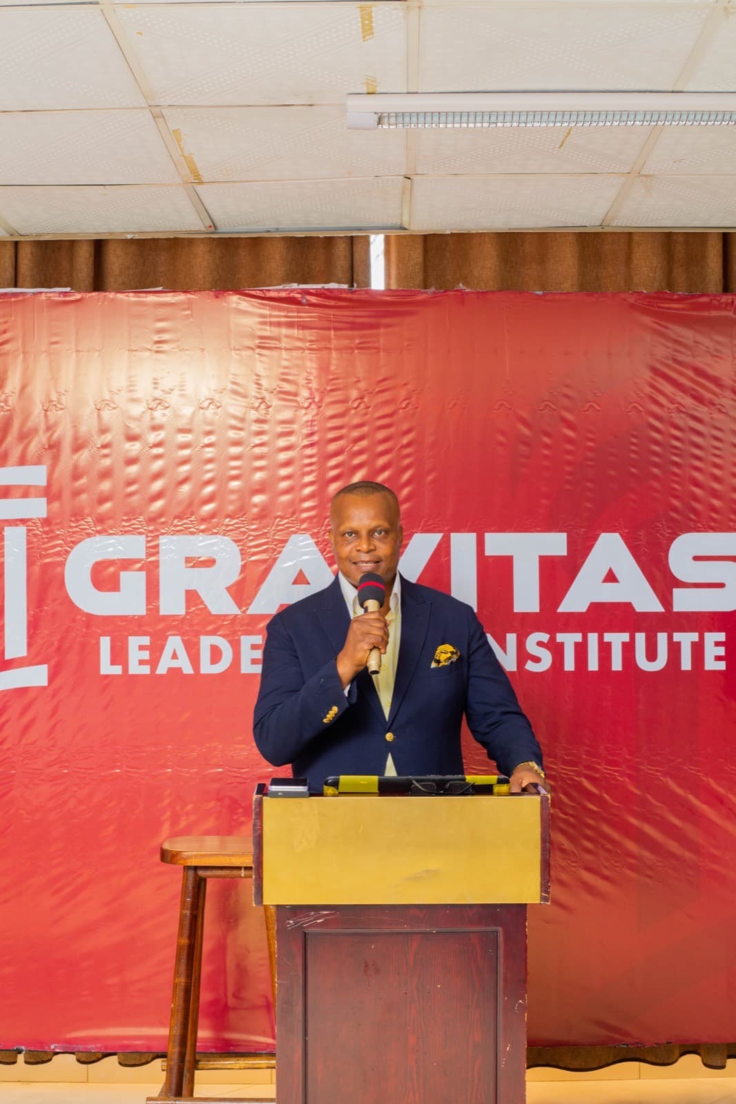 The founder speaking to the room