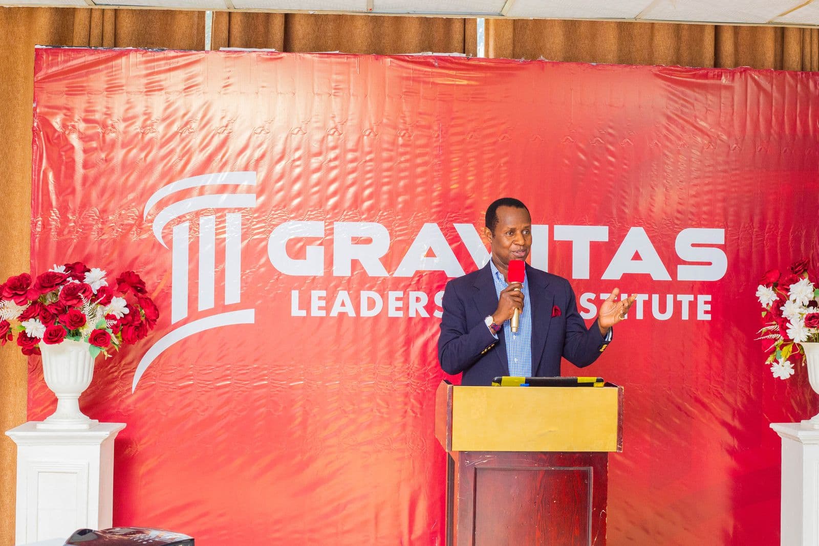 Prince Wasajja addressing the workshop from the podium